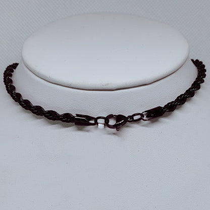 Midnight Steel: 4mm Black Enamel Rope Necklace displayed on a stand, showcasing its durable design and sleek style.