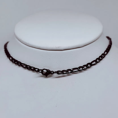 4mm Black Figaro Chain Necklace – Durable Enamel-Coated Stainless Steel on display.
